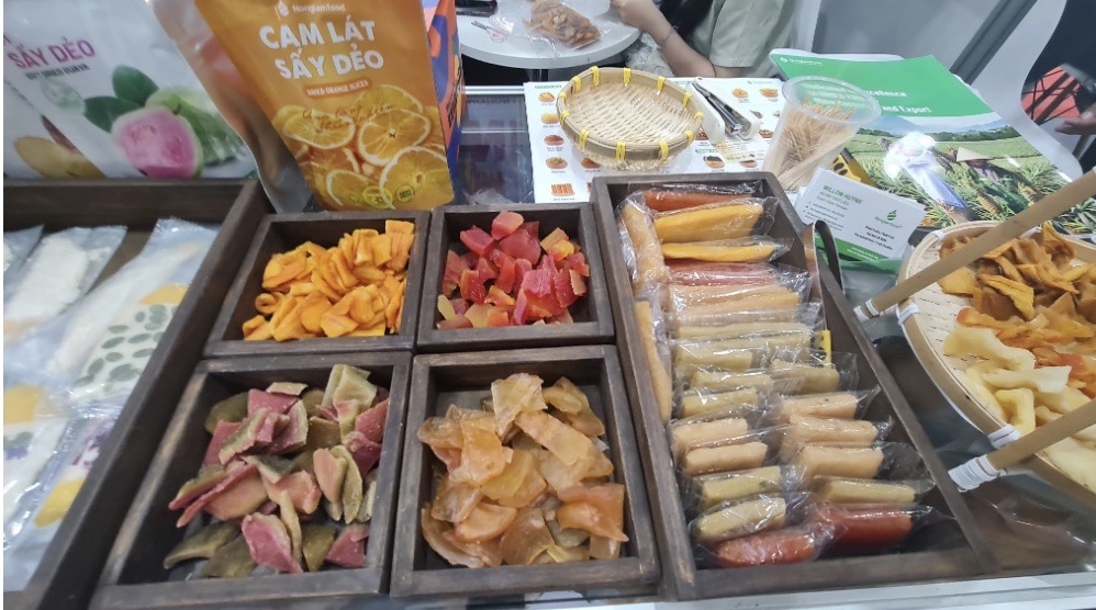 A diverse display of Nong Lam Food premium dried tropical fruits including mango, guava, and orange slices