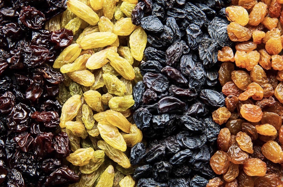 Different varieties of dark and golden raisins which are naturally rich in iron and antioxidants