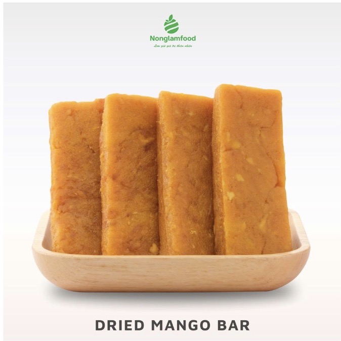 Convenient and healthy dried mango fruit bars arranged on a wooden tray